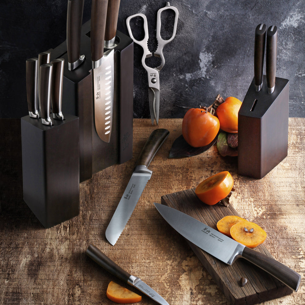 
                  
                    Load image into Gallery viewer, Set of knives in wooden blocks on a rustic wooden surface with fruits.
                  
                