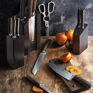 
                  
                    Load image into Gallery viewer, Set of knives in wooden blocks on a rustic wooden surface with fruits.
                  
                