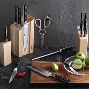 
                  
                    Load image into Gallery viewer, Set of knives, a cutting board with apples, and kitchen shears on a dark surface.
                  
                