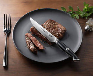 
                  
                    Load image into Gallery viewer, Cangshan Thomas Keller Signature Collection 5-inch Fine-Edge Steak Knife, Forged Swedish Powder Steel
                  
                